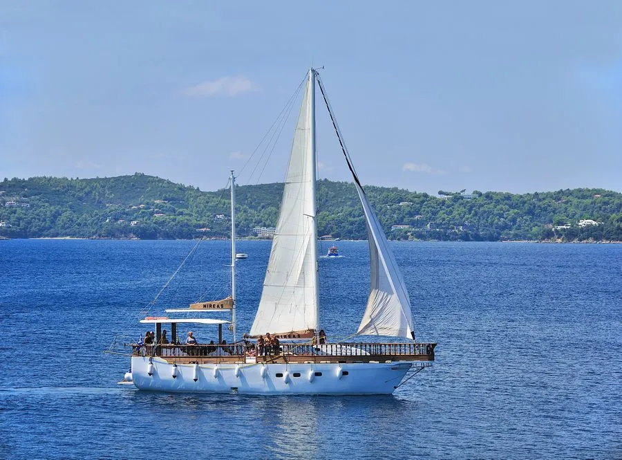 Nireas under sail in the blue Aegean